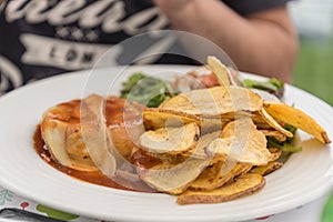 A typical dish consisting of a meat burger and Azorean cheese in Ponta Delgada on the island of Sao Miguel in th photo