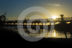 Quinta do Lago Bridge in Ria de Formosa natural park in Faro, Algarve in Portugal during sunset