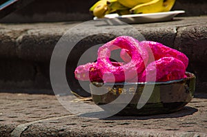 QUITO, ECUADOR- MAY 23, 2017: Oblation pink bagel at Plaza Grande in Quito