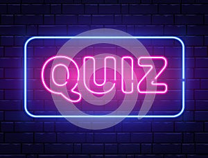 Quiz neon text banner on brick wall. Questions team game. Quiz night poster. Pub neon signboard. Night bright photo
