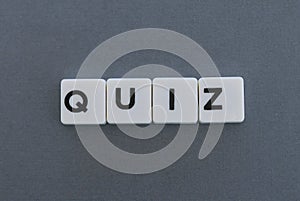 Quiz word made of square letter word on grey background