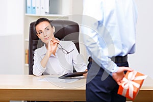 Quizzical office manager sitting at the desk