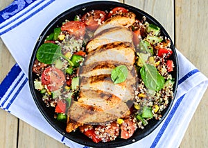 Qunioa salad with grilled chicken photo