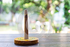 Quoits, wooden toy on wooden texture in bokeh garden background, Selective focus, Close up shot, Game and Recreation for children