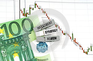 On the quote chart there are euros and clothespins with the inscription - Investment Strategy Review