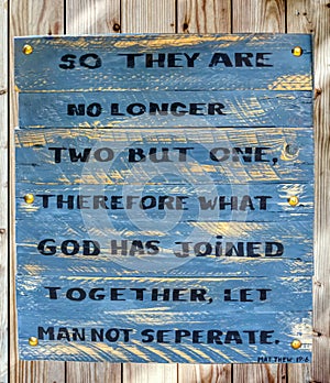 quote from Mathew handwritten on a wooden board