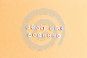 Quote Moms are magical made of round beads with multicolored letters.