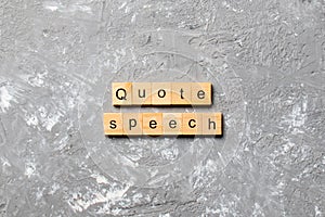 Quote speech word written on wood block. quote speech text on cement table for your desing, concept