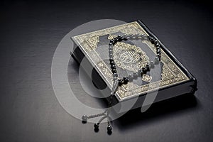 Quran Holy Book and Beads photo