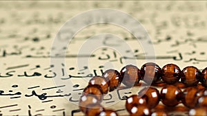 Quran the holy book of muslim religion and Pray Counting Bead