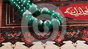 Quran the holy book of muslim religion and Pray Counting Bead