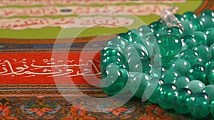 Quran the holy book of muslim religion and Pray Counting Bead