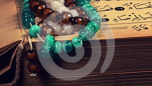 Quran the holy book of muslim religion and Pray Counting Bead