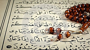 Quran the holy book of muslim religion and Pray Counting Bead
