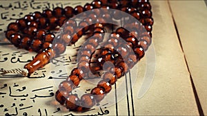 Quran the holy book of muslim religion and Pray Counting Bead