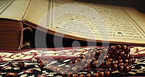 Quran the holy book of muslim religion and Pray Counting Bead