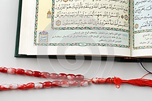 The Quran literally meaning the recitation, is the central religious text of Islam photo