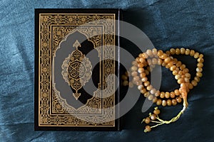 The Quran pak- holy books of Muslims and beads Ramadan kareem/Eid al fitr Concept.
