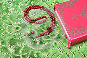 Quran, rosary beads.