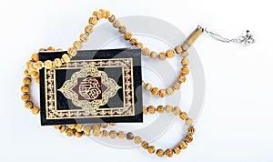 Quran with Rosary - holy book of Muslims - Koran - quran white background