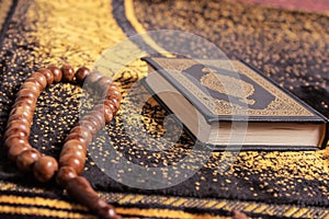 Quran and tasbih photo