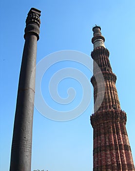 The Qutub Minar minaret and the iron pillar in New Delhi, India.