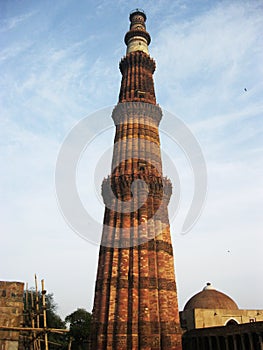 Qutub Minar in Vertical Position with blue sky background.- 222 JULY 2017.