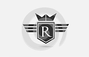 R alphabet letter logo icon for company in black and white. Creative badge design with king crown wings and shield for business