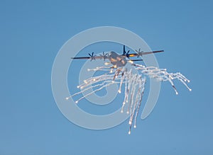 A RAAF Hercules transport aircraft deploying anti missile flares