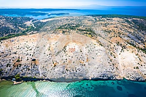 Rab island gigantic amblem of Croatia in stone desert near Lopar aerial view