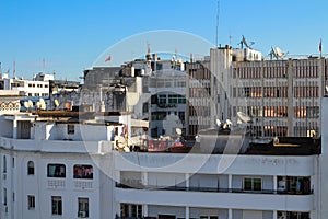 Rabat houses with narrow Windows, balconies, drying clothes and lots of satellite dishes
