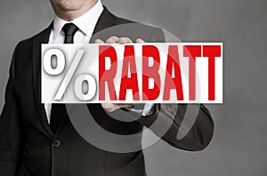 Rabatt in german Discount signboard is held by businessman photo