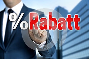 Rabatt in german Discount touchscreen is operated by businessm photo