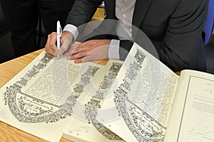Rabbi signing Ketubah Jewish Prenuptial Agreement