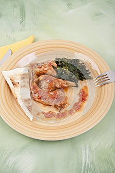 Rabbit cacciatore with spinach photo