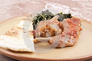 Rabbit cacciatore with spinach