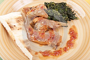 Rabbit cacciatore with spinach