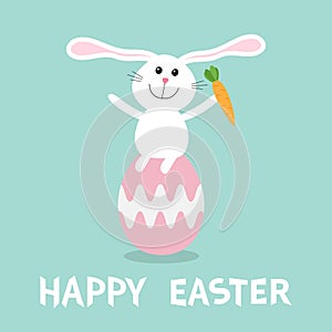 Rabbit with carrot sitting on painting pink egg shell. Happy Easter bunny pyramid set. Farm animal. Cute cartoon funny character.