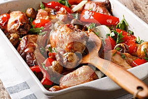 Rabbit baked with mushrooms, sweet pepper and onions macro in a