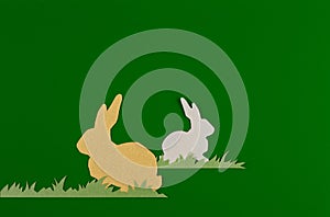 Rabbit and grass on a green background