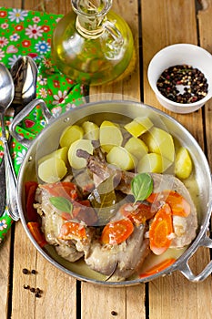 Rabbit legs stewed in mustard gravy sauce