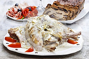 Rabbit in onion sauce on party table