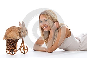 Rabbit riding bike to young woman