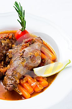 Rabbit stew with vegetables and herbs