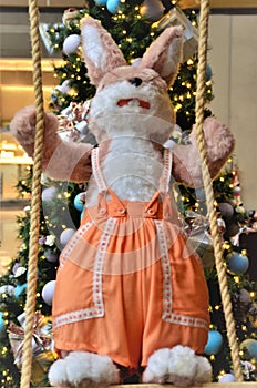 Orange Bunny on Christmas Scales photo