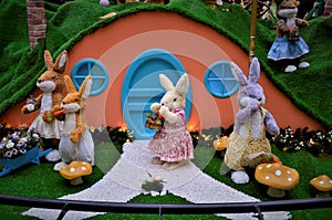 Rabbits dressed in front of the house in the decoration of the Mall photo