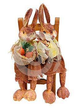 Rabbits papier sitting on chair straw