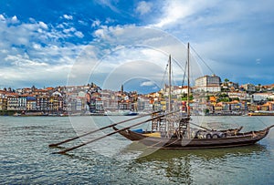 Rabelo, traditional boat with wine barrels in Porto, Portugal