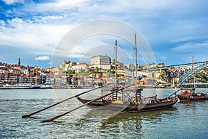 Rabelo, traditional boat with wine barrels in Porto, Portugal photo