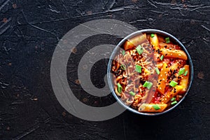 Rabokki, tteokbokki or topokki with ramen, Korean street food, spicy rice cakes photo